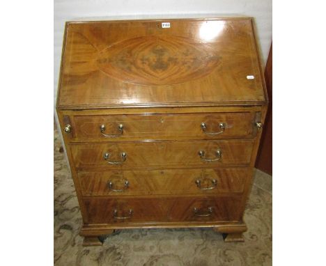 A good quality Edwardian mahogany writing bureau in the Georgian style with string inlaid detail, the fall flap enclosing a f