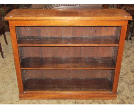 A Victorian stained pine, dwarf freestanding open bookcase, with two adjustable shelves, set on a moulded plinth, 112cm wide 