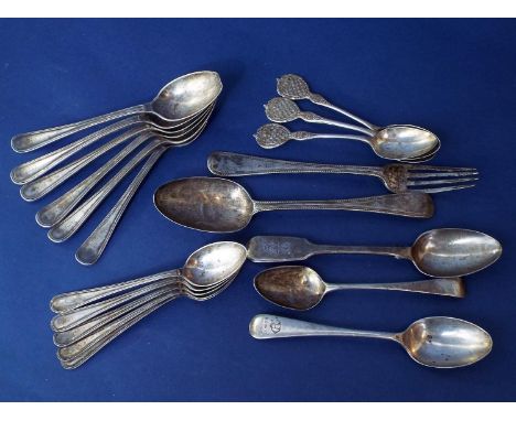 A mixed collection of antique silver flatware comprising dessert spoon, dessert fork, seventeen various silver teaspoons, 12.