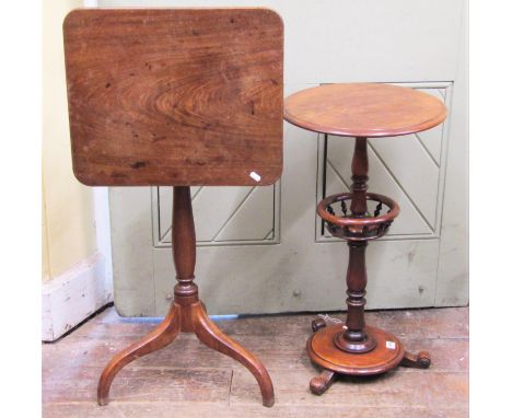 A small 19th century mahogany snap top occasional table of rectangular form with rounded corners raised on a simple vase shap