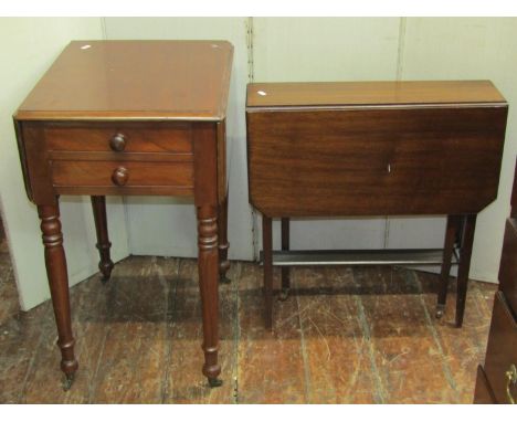 A small 19th century mahogany snap top occasional table of oval form with crossbanded detail raised on a turned pillar and sc