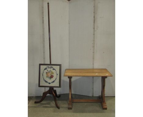 A 19th century fruitwood pole screen stand with turned column and swept tripod with later associated rise and fall screen, to