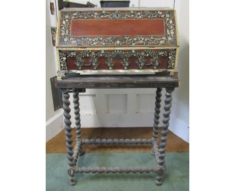 An 18th century Vizagapatam table bureau in sandalwood and ebony with trailing ivory and penwork floral bands and panels.  Th