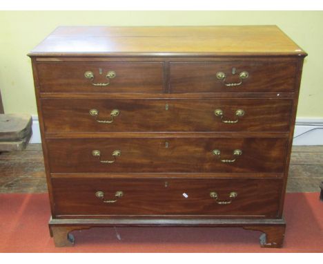 A Georgian mahogany bedroom chest of two short over three long graduated oak lined drawers with swan neck handles and bracket