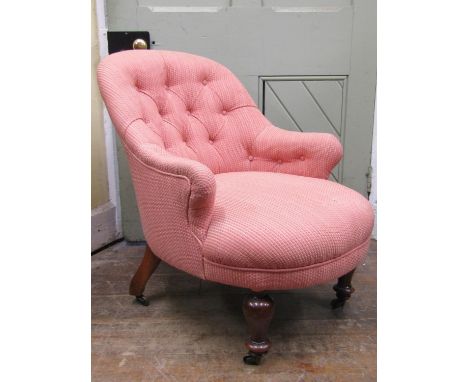 A Victorian button back drawing room/bedroom chair with shaped outline and repeating pink lattice patterned upholstered finis