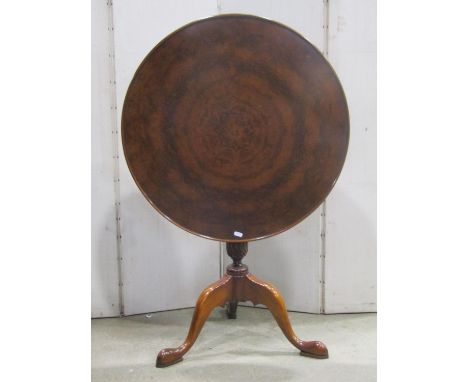 A good quality reproduction mahogany snap top occasional table of circular form, with well matched sunburst walnut veneered t