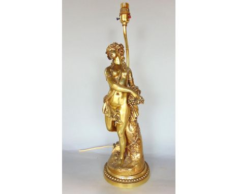 Cast ormolu figural table lamp of a nude maiden carrying a basket of grapes, the lamp 52cm high (not including shade) 