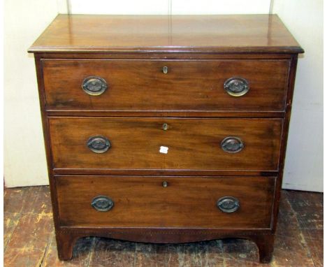 A small 19th century mahogany bedroom chest of three long drawers with shaped apron, bracket supports and inlaid detail, 85 c