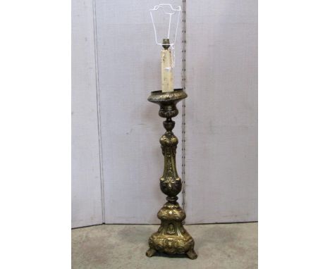 An embossed hollow brass pricket type table lamp with scrolling acanthus and further detail, 83 cm high excluding fitting 