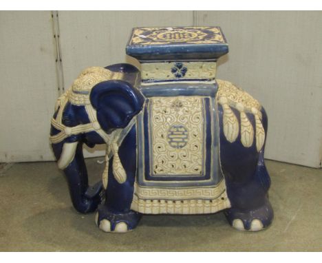 A blue and cream glazed ceramic garden/conservatory suite in the form of an Indian elephant with decorative head rest 