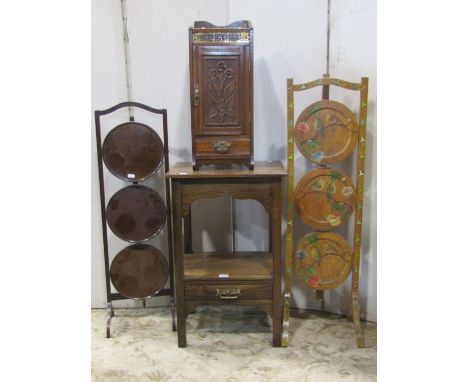 An oak two tier occasional/lamp table incorporating a frieze drawer, a Welsh spinning chair with carved scrolling dragon deta