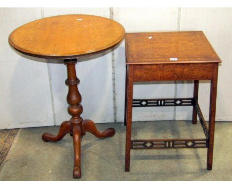 A Victorian oak or possibly ash occasional table of circular form, raised on a turned pillar raised on a scrolled tripod, tog