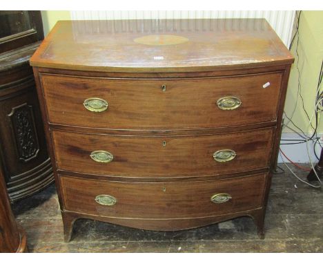 A Georgian mahogany bow fronted bedroom chest with satinwood crossbanding boxwood and ebony stringing, acorn and oak leaf inl