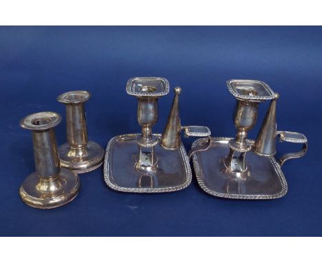 Pair of baluster candlesticks on circular plinth bases together with a further pair of silver platednight lantern sticks with