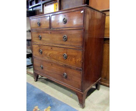 An early 19th century mahogany bedroom chest of two short over three long graduated drawers with splayed bracket supports, 10