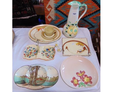 A collection of art deco ceramics including a Hancocks Ivory ware jug, 31cm tall approx, a Newport pottery Clarice Cliff meat