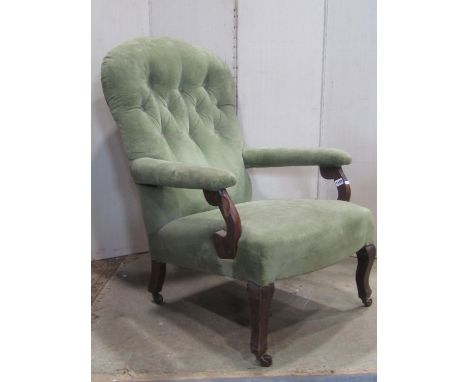 An Edwardian drawing room chair with sage green coloured upholstered seat button back and open arms, raised on shaped foreleg