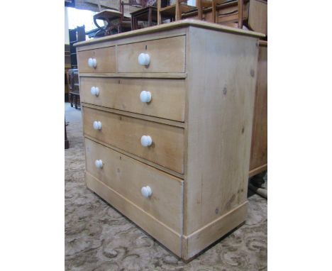 A Victorian stripped pine bedroom chest of two short over three long graduated drawers with ceramic handles, 106 cm wide 