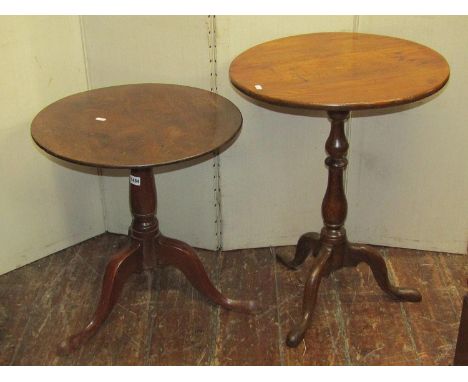 A 19th century Country made oak occasional table of circular form raised on a turned vase shaped pillar and swept tripod toge