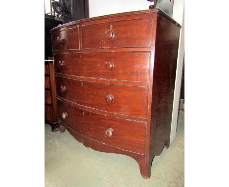A 19th century mahogany bow fronted bedroom chest of two short over three long graduated drawers with shaped apron and splaye