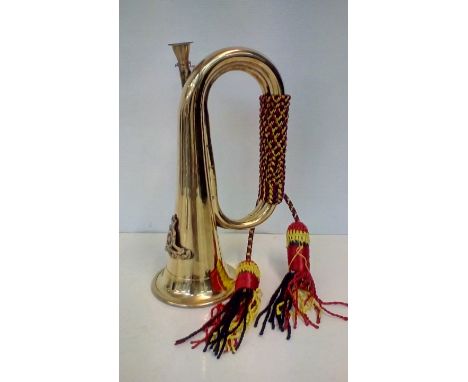Brass bugle with Artillery cap badge, length 26cm 
