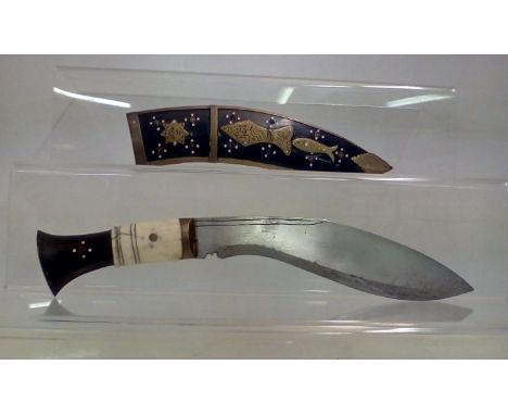 Interesting Kukri, ivory hilted with brass bound scabbard depicting fish, man and sun