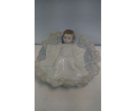 Nao figure of a boy in bed, 14 cm long