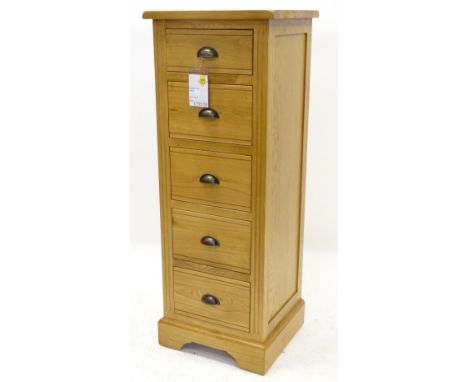 An ex shop display Hampton Court oak narrow chest or tall boy, with five drawers on bracket feet, 126cm H, 47cm W, retail pri