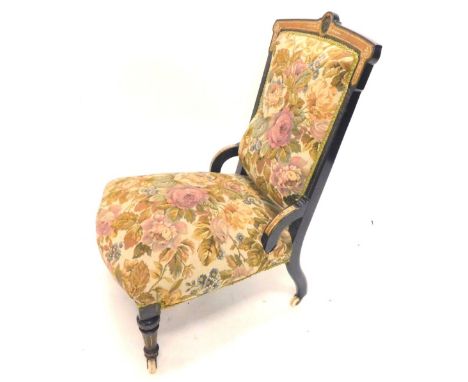 A late Victorian ebonised and walnut veneered nursing chair, the shaped back inset with a Wedgwood Jasperware back, with a pa