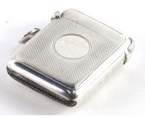 A George V silver Vesta case, with engine turned decoration and a circular vacant cartouche, Chester 1911, 1¼oz.