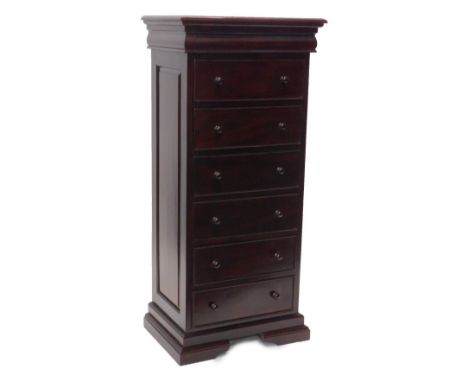 A narrow mahogany Versailles chest of drawers, the top with a moulded edge above seven drawers, (6 with turned wood handles),