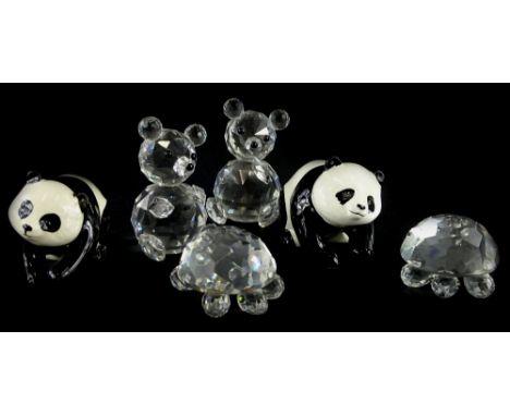 A collection of five figures, to include two Swarovski tortoises and two pandas or bears, and a pair of Beswick ceramic panda