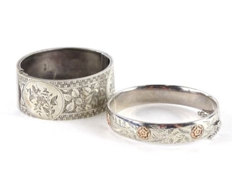 Two Victorian silver hinged bangles, to include a hinged bangle with gold roses, and fern design, with safety chain, 6.5cm W,