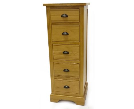 An ex shop display Hampton Court oak narrow chest of five drawers, with bronzed metal handles, on bracket feet, 126cm H, 47cm