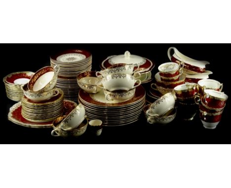A Crown Staffordshire part tea service, decorated with swags, in gilt on a deep red ground, and a similar Meakin sol pattern 
