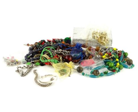 A quantity of modern and vintage costume jewellery, to include semi precious stone necklaces, gold plated chains, silver bang