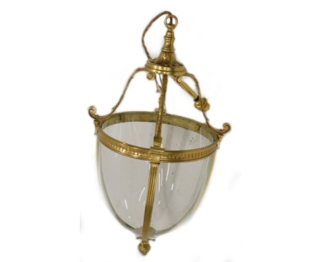 A Victorian style brass hall lantern, with four bowed glass panels and a pineapple finial, 60cm to the top of the fitting.