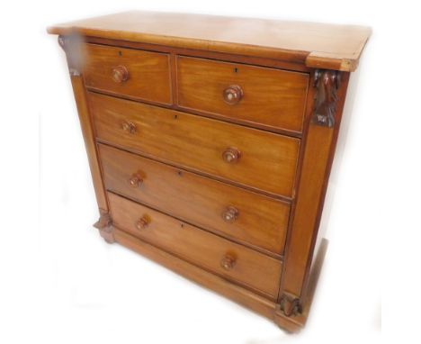 A Victorian mahogany chest of drawers, with two short, three long drawers, with turned wood handles, centred with mother of p