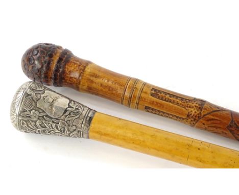 A malacca walking stick, with embossed and repousse white metal handle, decorated with leaves, possibly Indian, and an Orient