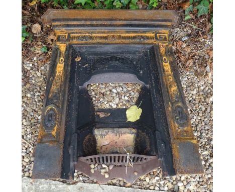 A late 19th/early 20thC cast iron fire surround, decorated with scrolls, patera, etc., 93cm W.