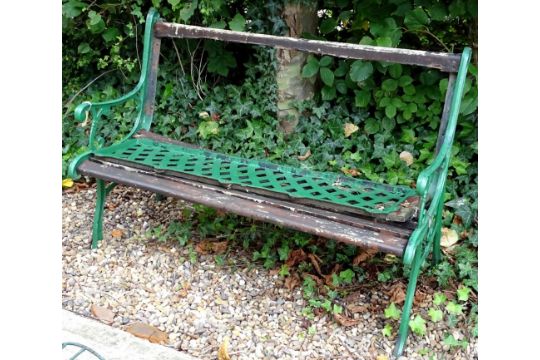 A cast iron and wooden garden bench, (AF), 128cm W.