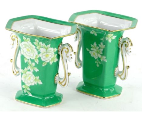 A pair of Noritake porcelain two handled vases, each decorated with flowers on a green ground, printed marks in green to unde