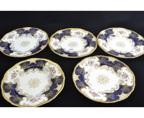 Five Coalport dessert plates, late 19th/early 20th century, retailed by T. Goode & Co., printed and painted with flowers to a