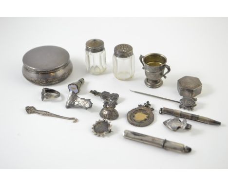 Collection of silver, some hallmarked, including: two pill pots, miniature trophy, two napkin clips, three brooches, ring, fo