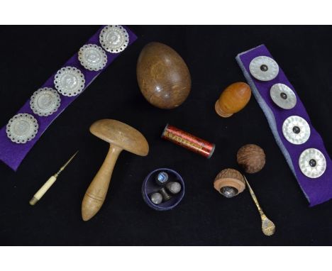 Collection of Victorian carved mother-of-pearl buttons (30mm diameter), wooden walnut thimble case, (50mm height) together wi