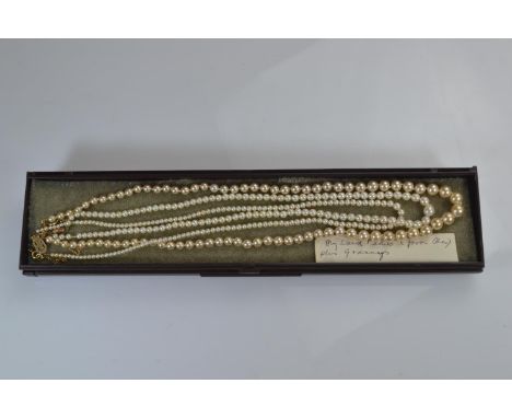 Two 9ct gold clasped pearl necklaces, & a simulated pearl necklace with a 9ct gold clasp 