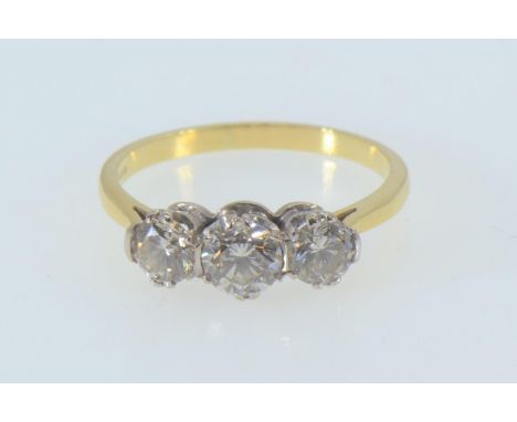 18ct gold & three stone diamond ring, the centre stone weighing approx. 0.50 carat, size R, 3.55 grams 