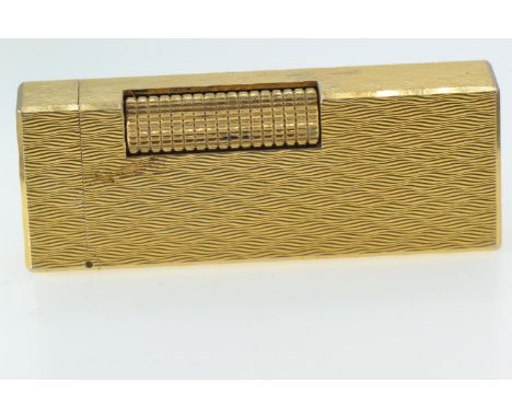 Dunhill gilt metal lighter, marked to base 'Made in Switzerland US.RE24163 Patented', length 6.5cm 