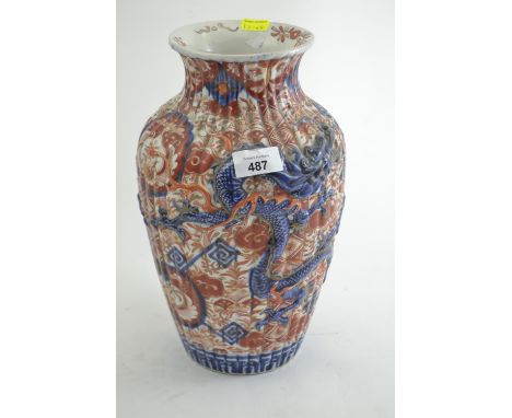 Japanese imari vase, late 19th century, the ribbed body moulded in relief with two writhing dragons, height 30cm 