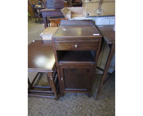 OAK FRAMED AND PLYWOOD BEDSIDE CUPBOARD WITH SINGLE DRAWER WITH OPEN SHELF OVER PANELLED CUPBOARD DOOR WITH BRASS BUTTON HAND